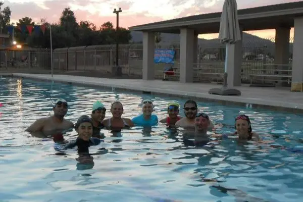 A group of adults in a swimming pool