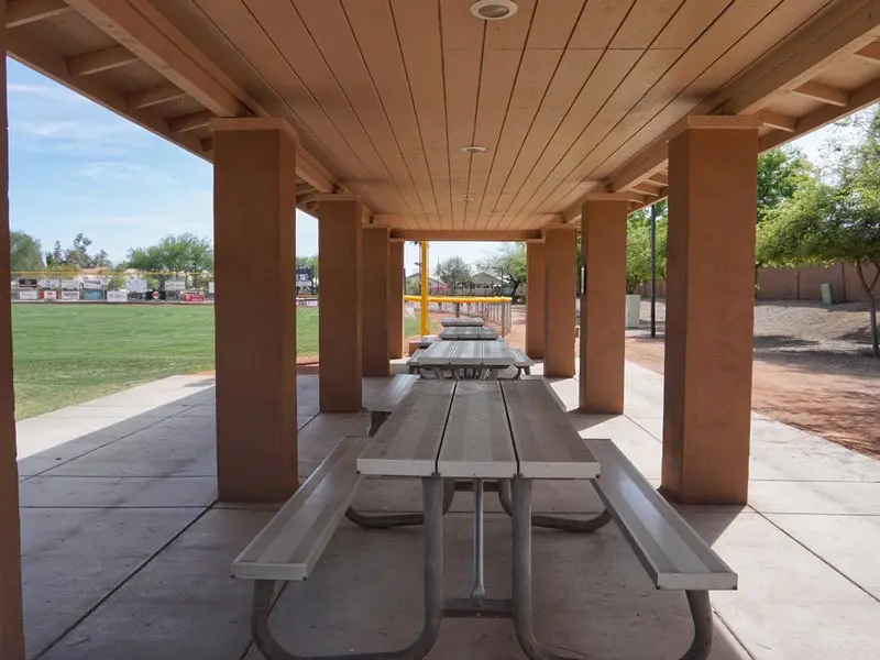 A ramada with tables and chairs