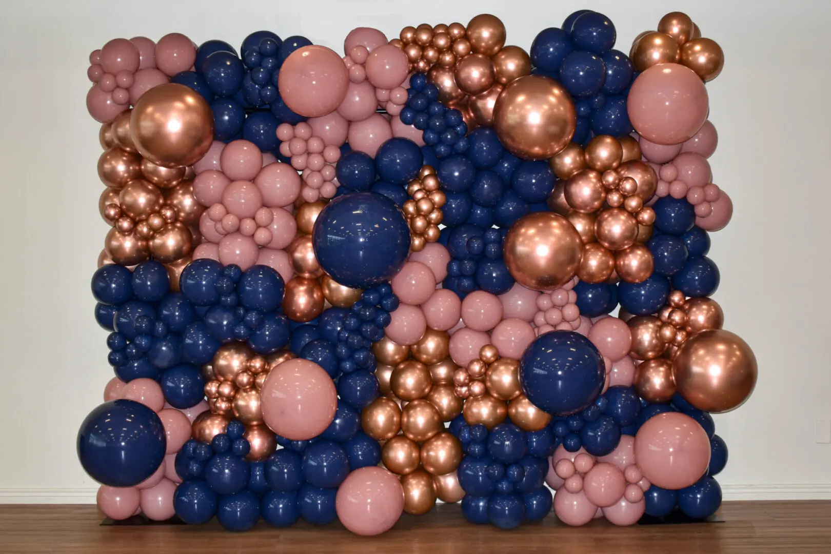 A Wall With Pink and Blue Color Balloons